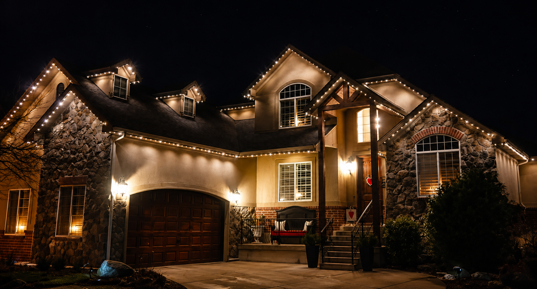 House illuminated with warm white roofline lighting
